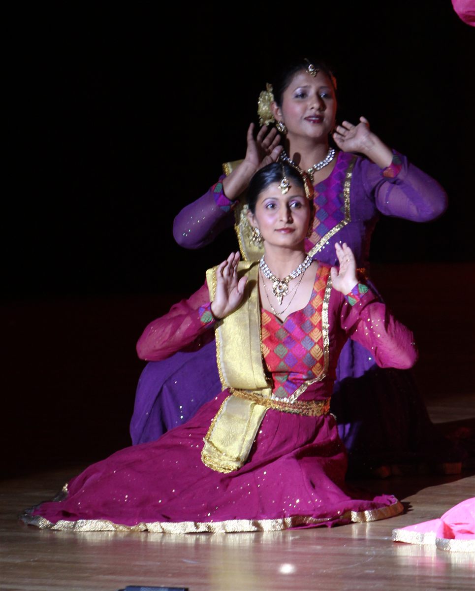 Aarti Gupta and Sapna Adhikari performing Kathak on stage in purple and magenta lehengas