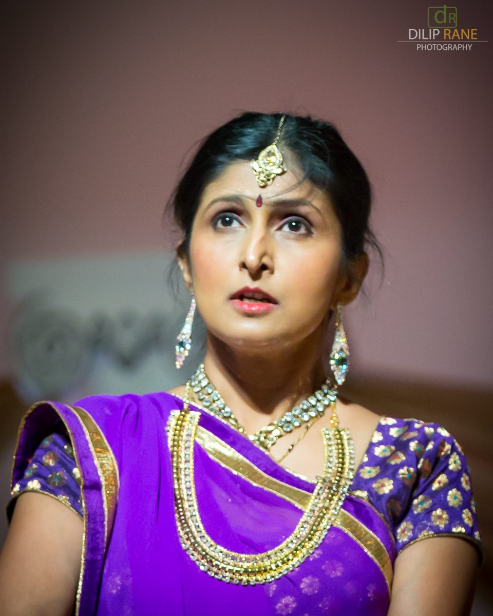 Sapna Adhikari in expressive Kathak performance in purple saree with gold jewelry