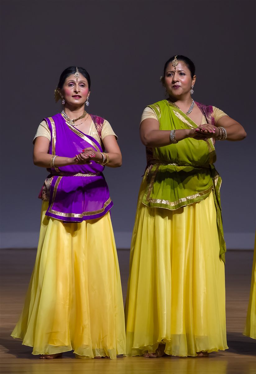Sapna Adhikari and Aarti Gupta performing Kathak in yellow and purple lehengas